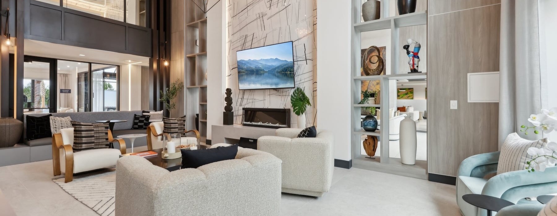 a room with a large television and chairs