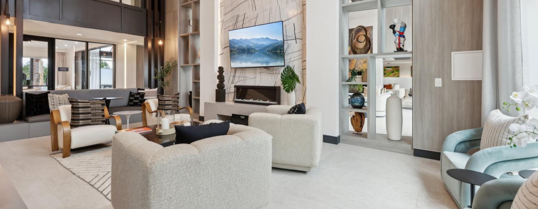 a room with a large television and chairs
