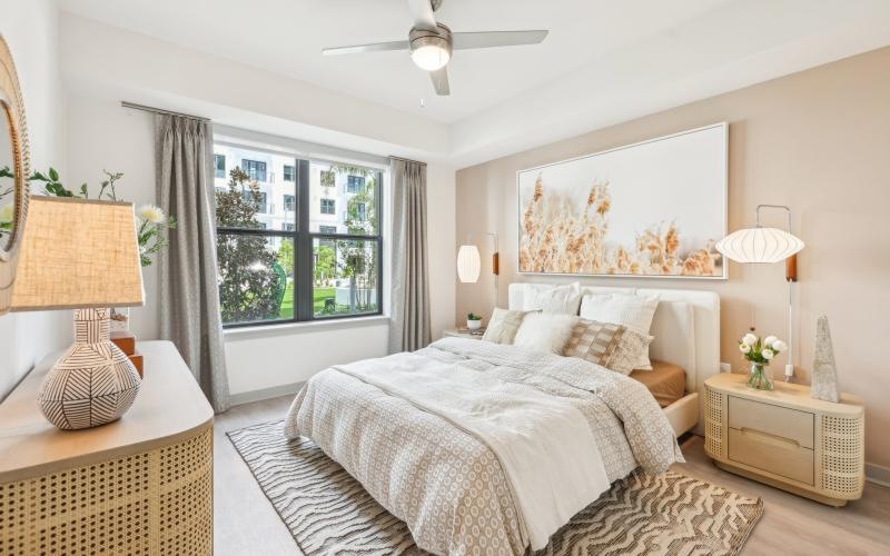 a bedroom with a large window
