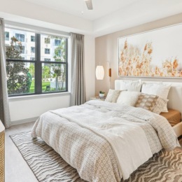 a bedroom with a large window
