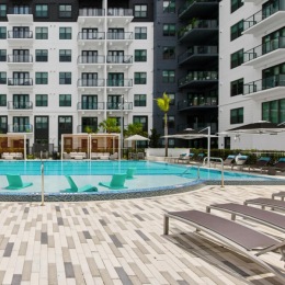 a pool in a courtyard between buildings