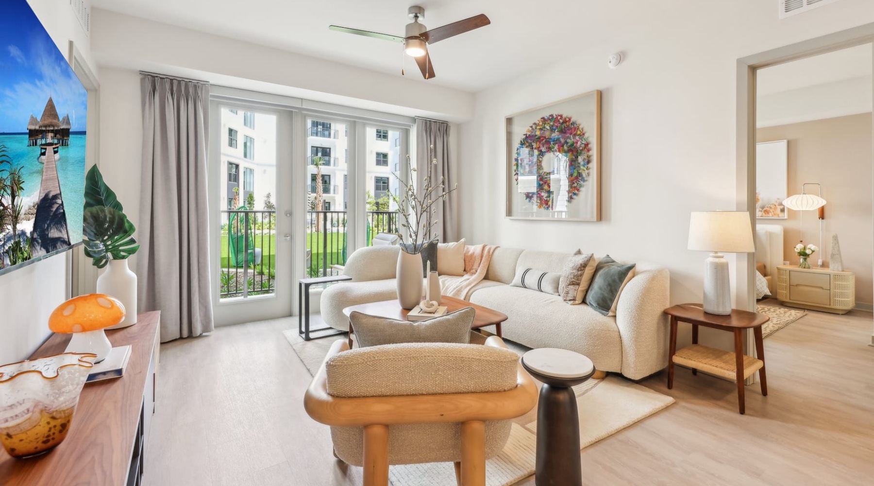 living room with a large window and open spaces