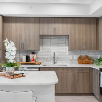 Kitchen with oak cabinets and large island at The CenterPointe in Orlando, FL